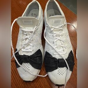 Nike Flyknit Racer Sneakers with Black Bow Detail